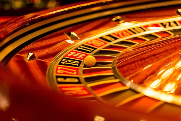Live dealer spinning the roulette wheel